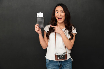 Amazing excited asian young woman tourist