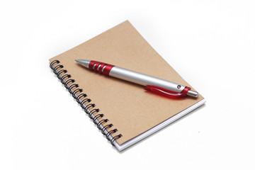 Notebook with pen isolated on white background