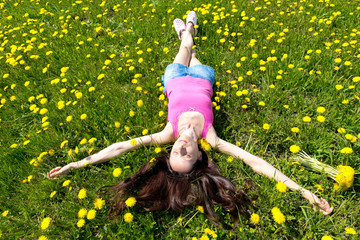 Portrait of a girl in dandelion field