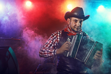 The actor plays the accordion.