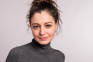 Portrait of a young beautiful woman in studio.