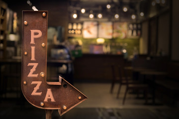 Pizza shop signboard, in front of the store . Retro style - obrazy, fototapety, plakaty