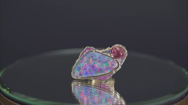 Jewelry ring on the stand. A precious ring. Ring with precious metal.