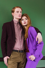 Low angle view of stylish young couple of models