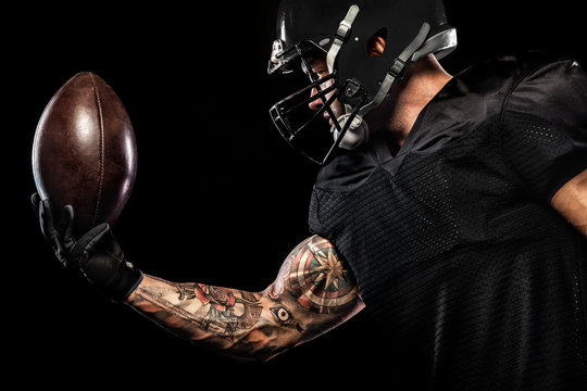 American football sportsman player isolated on black background