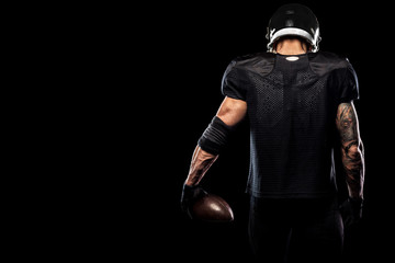 American football sportsman player isolated on black background - Powered by Adobe