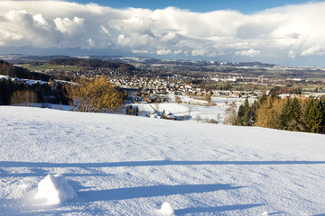 landscape of village in st. gallen in winter season, covered with snow, Switzerland