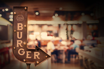 Burger title signboard, in front of the store . Retro style