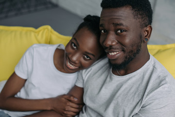 Fototapeta premium beautiful young african american couple smiling at camera