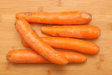 Organic Carrots on wooden table