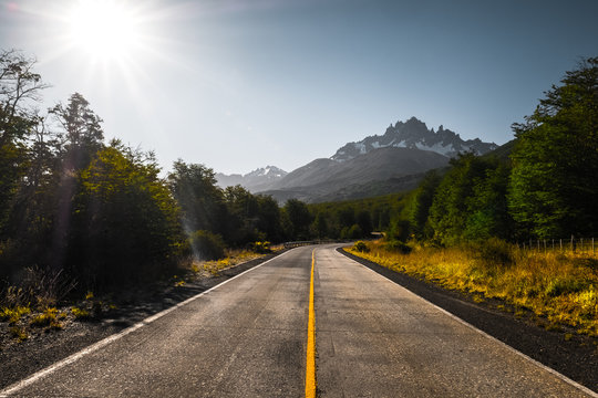 Asphalt road and mountains. Carretera Austral road near the Cerro Castillo mountain (Cerro Castillo peak is on the background). Chile