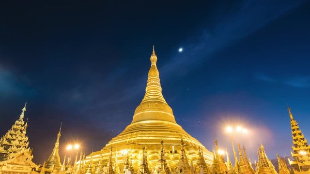 Shwedagon Pagoda in Yangon, Myanmar (Burma), time lapse view of the famous Buddhist landmark at night.