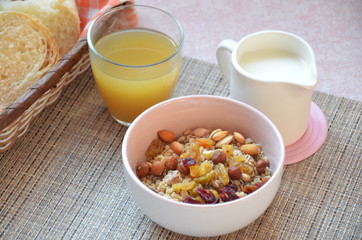 Healthy Breakfast: oatmeal, muesli, dried fruit, fruit juice, mil, crispy bread top view.