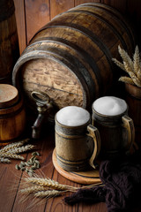Light foam beer in a glass on an old background