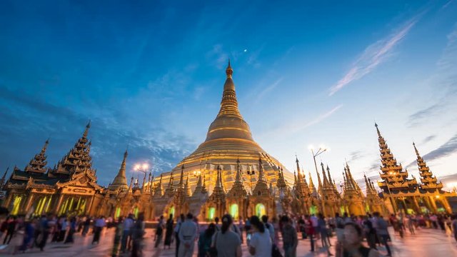 Shwedagon Pagoda in Yangon, Myanmar (Burma), time lapse view of the famous Buddhist landmark at sunset.