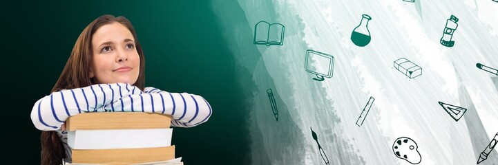 Young woman with a pile of books looking up and drawings on