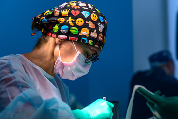 Surgeon operating a patient in operating room