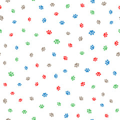 Colored paw prints of cats and dogs. Cute seamless pattern.