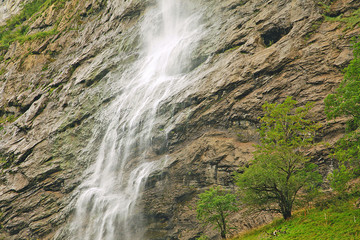 beautiful waterfall falling from a cliff, mountain texture