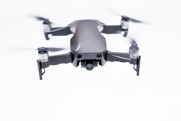 Pancevo - Serbia 03.01.2018. DJI Mavic Air drone flying mid air isolated on white bacground. Smallest foldable drone  with 4K capability