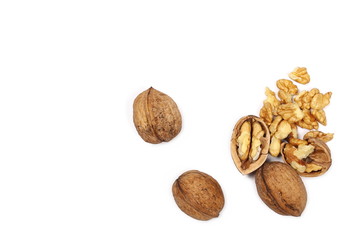 Cracked walnuts isolated on white background, top view