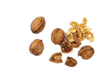Cracked walnuts isolated on white background, top view