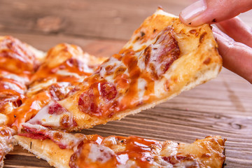 Pepperoni pizza on rustic background.