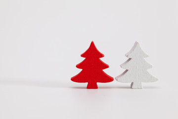 Naklejka na ściany i meble Red and white wooden trees. Christmas decoration.