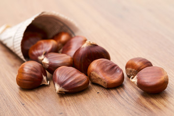 Obraz na płótnie Canvas edible chestnut on the table
