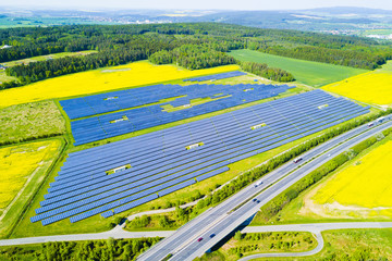 Aerial view of solar power plant. Solar farm system from above. Large photovoltaic power station...