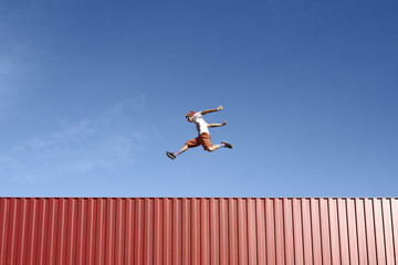 Jump Parkour Young Man Container Red Sky Blue © Daniel