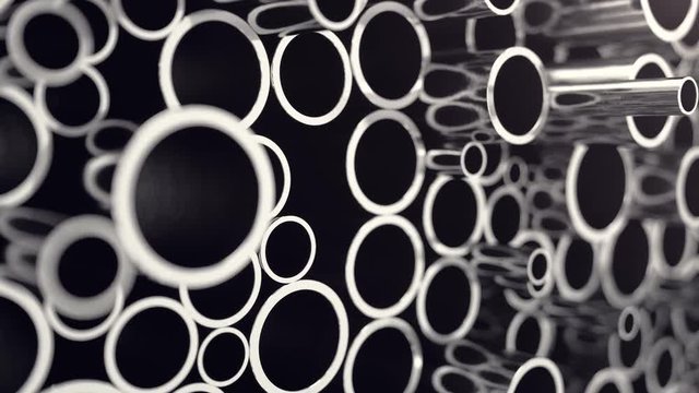 Metal pipes stacked. Heap of shiny metal steel pipes with selective focus effect. 3D animation 4k