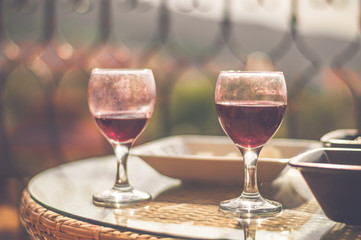 Red wine in dirty wine glasses left on table