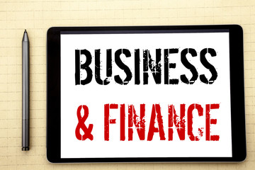 Handwritten text showing Business And Finance. Business concept writing for Company Strategy Written on tablet computer screen, white background in  office space view with pencil marker