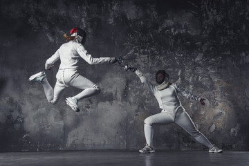 Two women fencing - Powered by Adobe