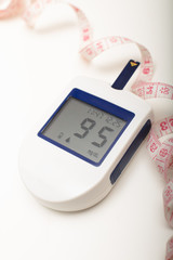 Portable glucose meter with tape measure