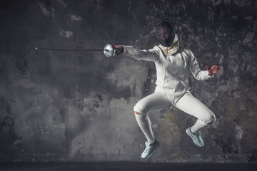 Fototapeta na wymiar Woman is fencing