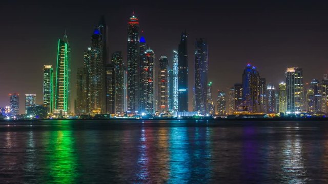 Dubai Marina night light illumination Palm Jumeirah bay panorama 4k time lapse UAE