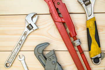 Tools for repair on light wooden background