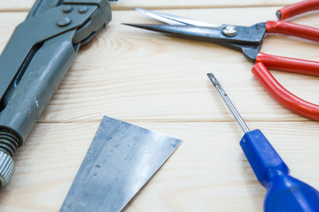 Tools for repair on light wooden background