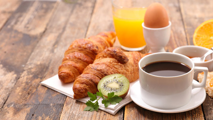 breakfast with coffee, egg and croissant