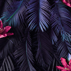 Creative tropic purple leaves layout. Supernatural concept. Flat lay. Ultra violet colors.