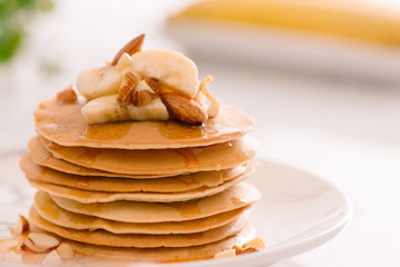 Breakfast. Banana pancakes with honey and nuts