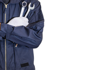 Car repairman wearing a dark blue uniform standing and holding a wrench that is an essential tool for a mechanic isolated on white background, Automotive industry and garage concepts.