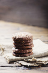 Sweet chocolate cookies on the wooden table