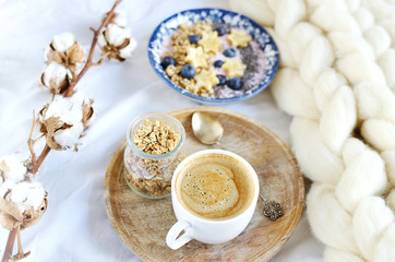 Fresh Breakfast Yogurt with Muesli Banana Berries Chia Seeds Granola Cotton Flower White Giant Knit Blanket Bedroom Healthy Lifestyle