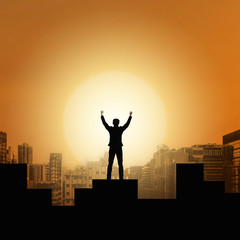 Businessman raise arms up in victory moment. Concept of victory, success or winning in business. 

