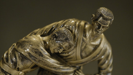 Cup for a victory in the judo championship. Cup for sporting achievement . The trophy represents two people in sparring