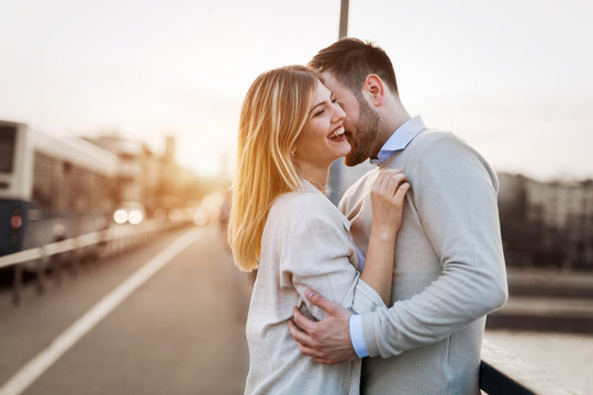 Couple kissing dating on bridge