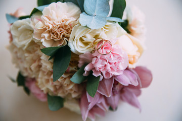 beautiful bride's wedding bouquet with yellow and pink roses on white background. Concept of floristics
